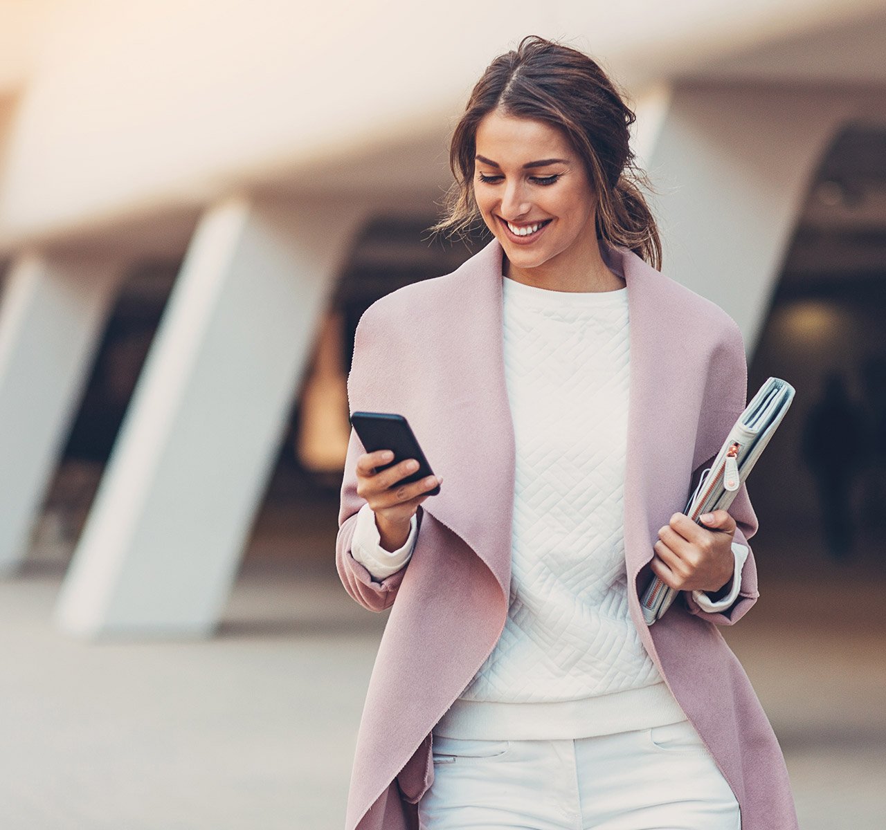 Women looking at mobile app enjoying her more rewarding Leaders accounts