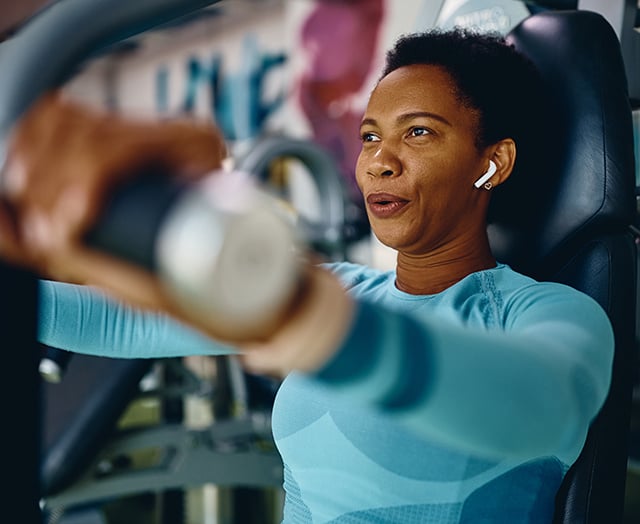 Female powering her payments by consolidating her debt with Leaders