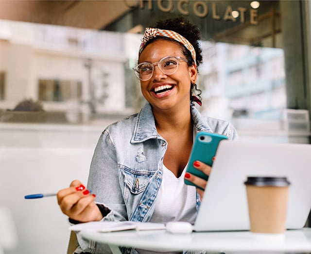 Young female happy reaching her savings goals with Leaders