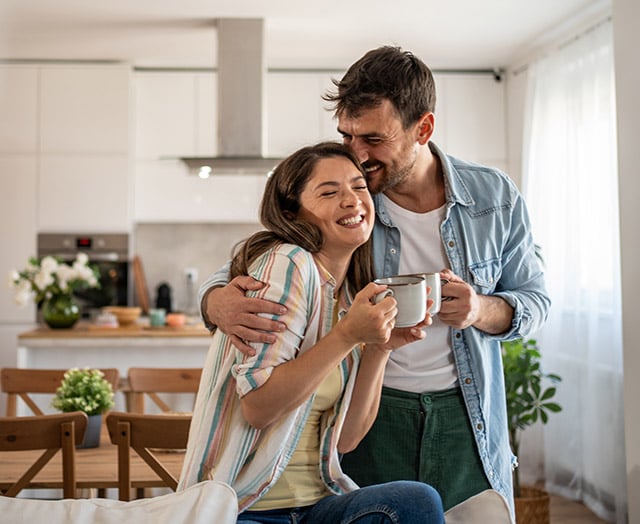 Happy couple growing their savings with Leaders