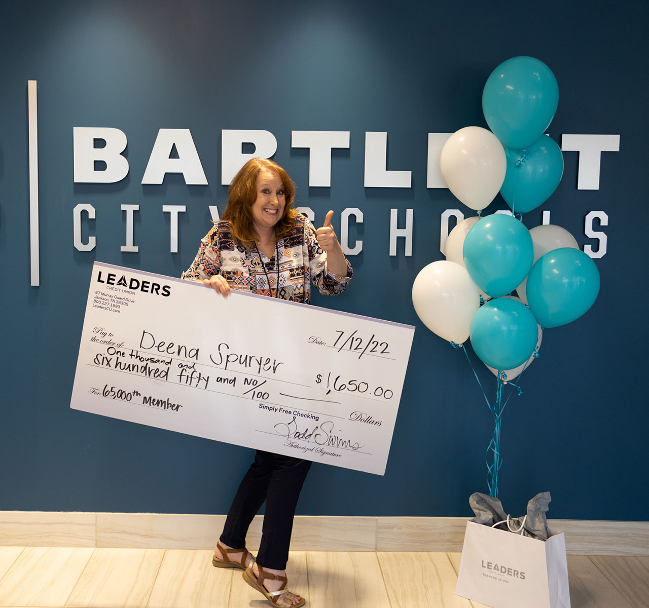 Leaders awards $1,650 to 65,000th member a Bartlett City School employee